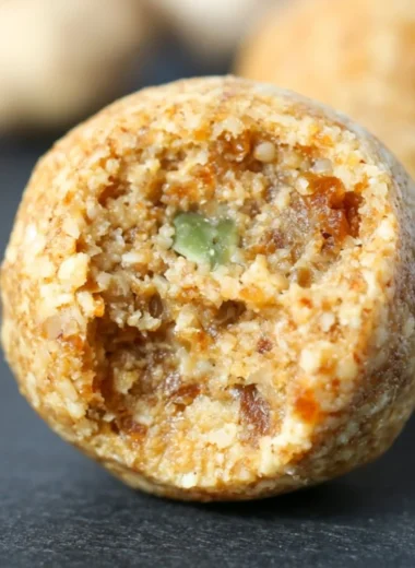 Cozy anti-inflammatory ginger energy balls on a wooden table