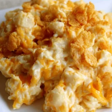 Creamy and cozy funeral potatoes dish served in a casserole dish.