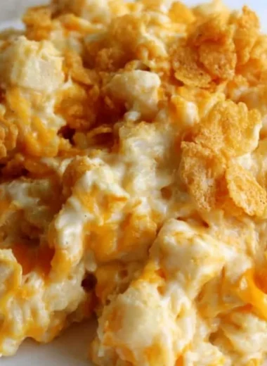 Creamy and cozy funeral potatoes dish served in a casserole dish.