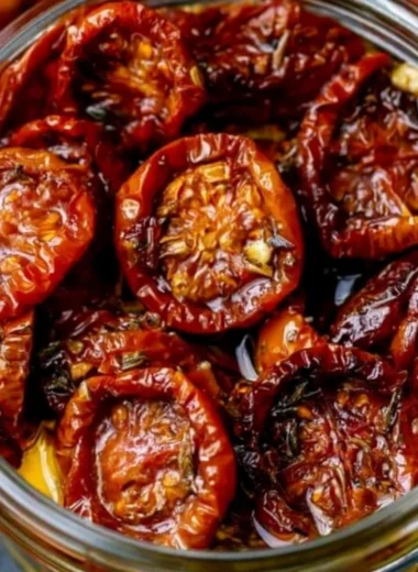 Delicious homemade sun-dried cherry tomatoes on a wooden cutting board