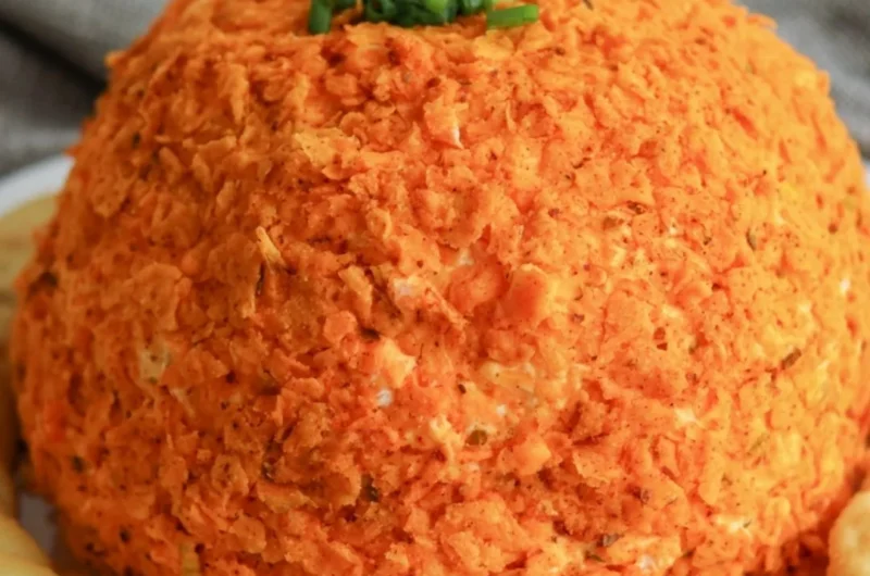 Delicious nacho cheese ball served with crackers and veggies