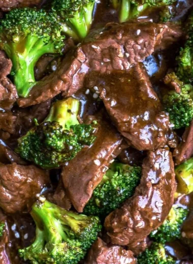 Delicious slow cooker beef and broccoli served with rice on a plate.