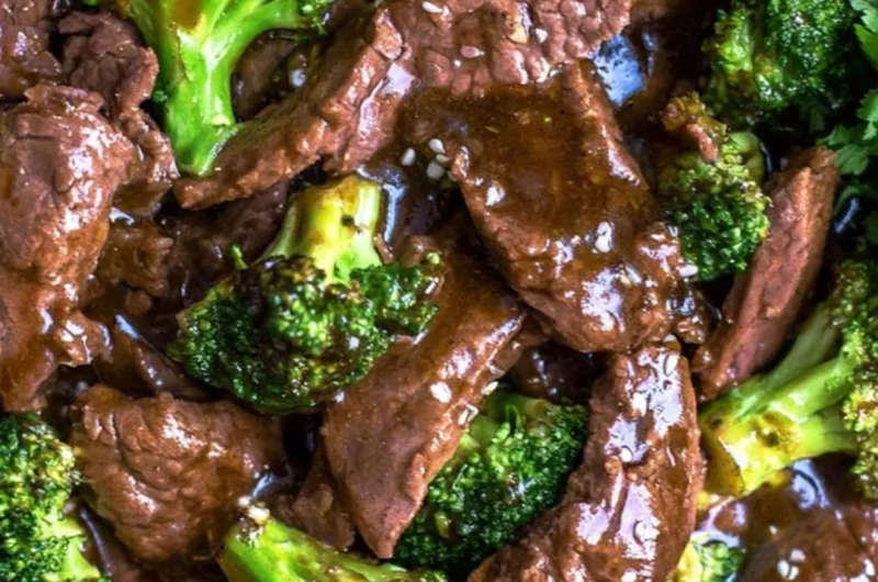 Delicious slow cooker beef and broccoli served with rice on a plate.