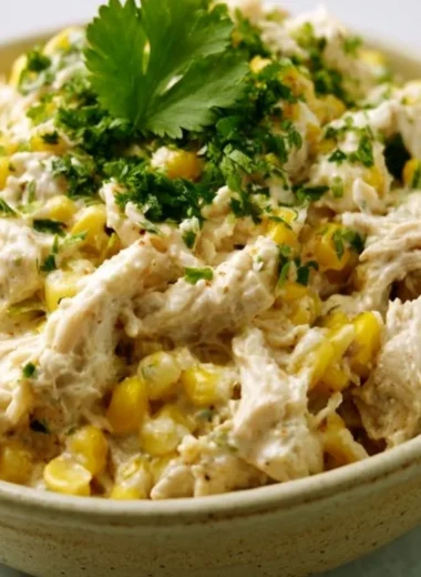 Crockpot street corn chicken dish with fresh ingredients ready to serve.